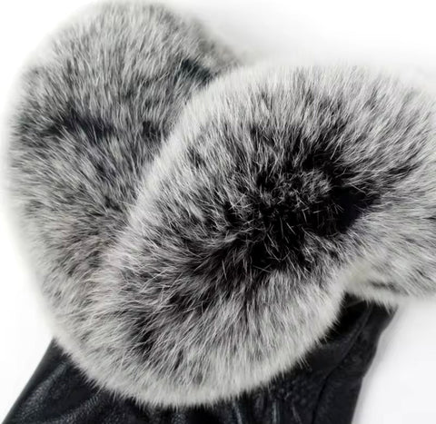 High-quality leather gloves featuring plush fox fur trim, combining style and cozy comfort.