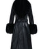 black leather trench coat with a dramatic black fox fur collar and matching cuffs creates an effortlessly elegant winter look, worn by a woman embracing modern sophistication.